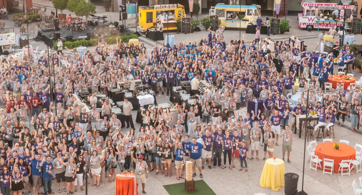 employees from insurance agency gather at employee event